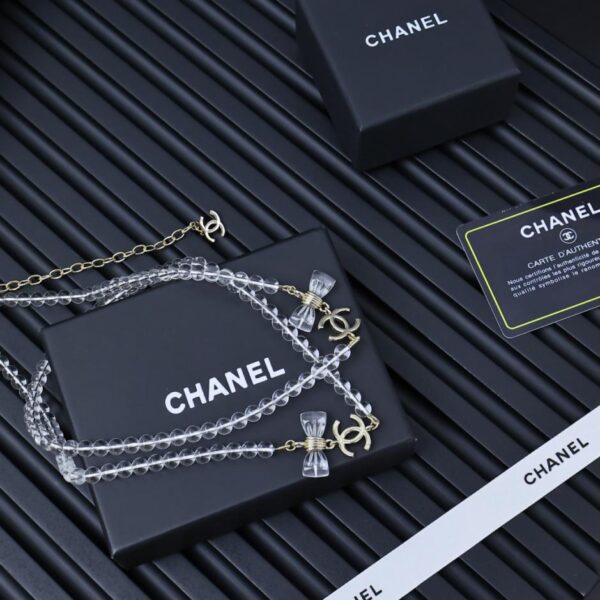 replik,replica,schmuck,1:1,beste,ohrringe,ring,Repliken Chanel 25p transparente Pulloverkette aus Acryl mit Doppelschleife (KL8UG)